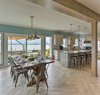 Modern Waterfront Home with Patio Fire Pit Dock